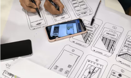 Designer reviewing analytics and KPIs that measure UI/UX design success