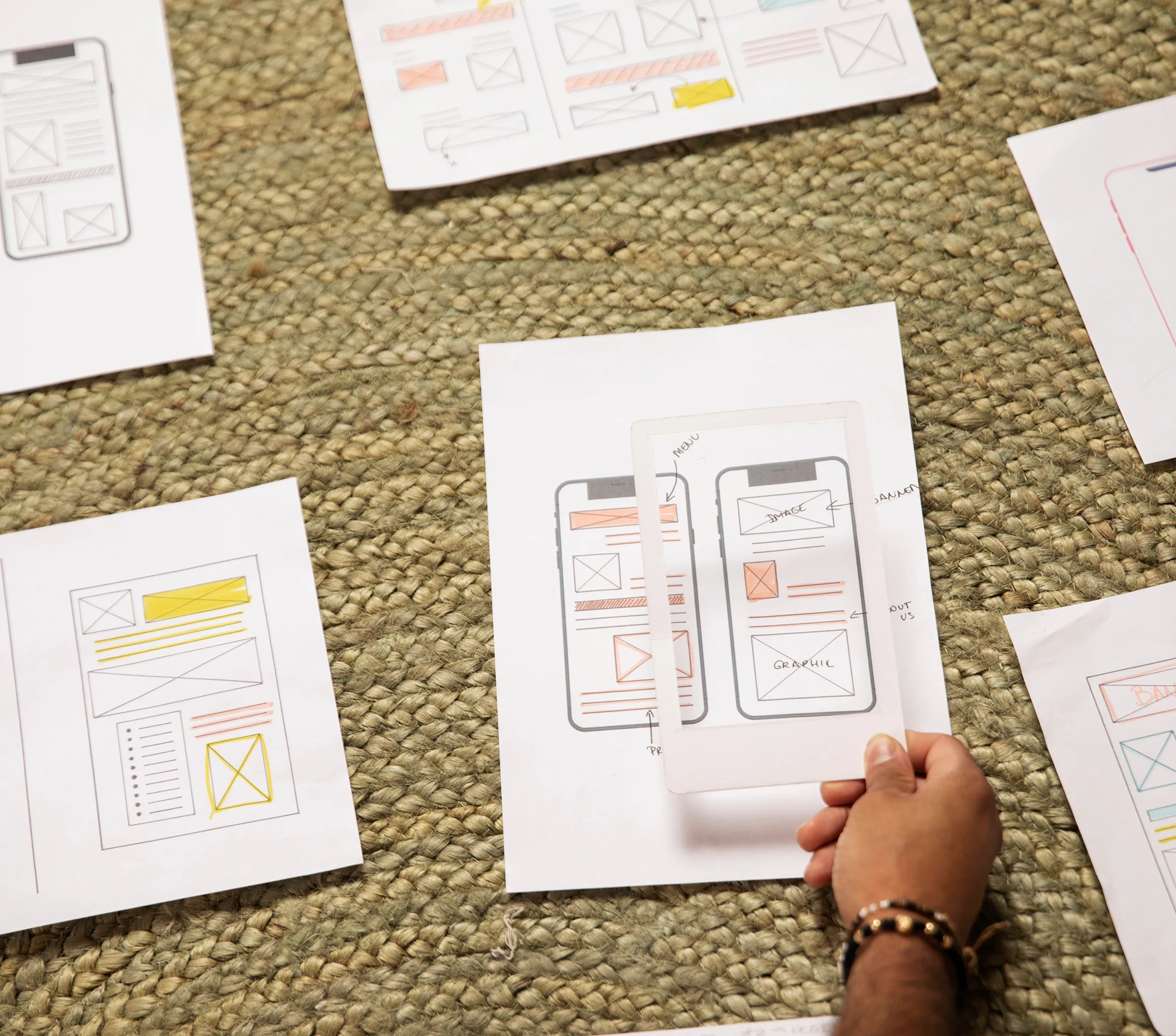 Designer reviewing app wireframes